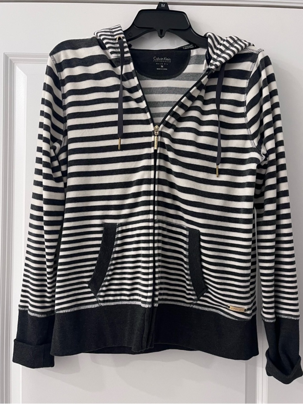 Calvin Klein Black & White Striped Hoodie with Gold Logo Plaque